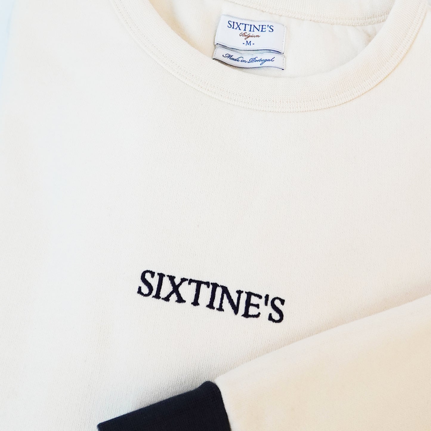 Two-tone cream with logo